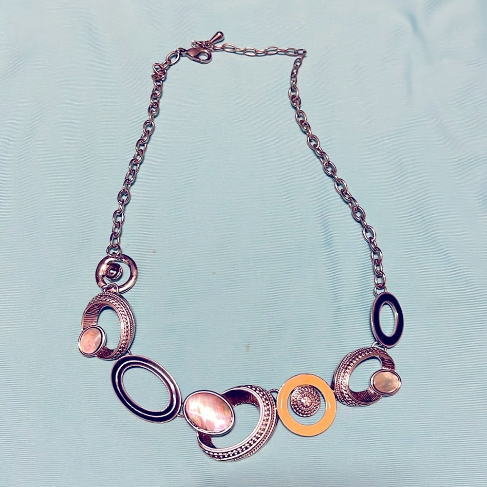Fun quirky necklace. Silver with yellow and black rings.